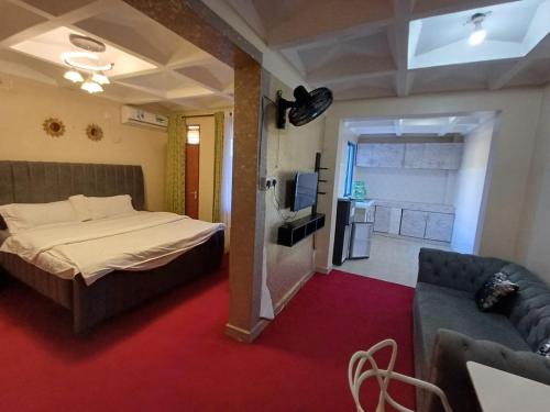 TV a/nebo společenská místnost v ubytování La Casa Hotel - Nyali