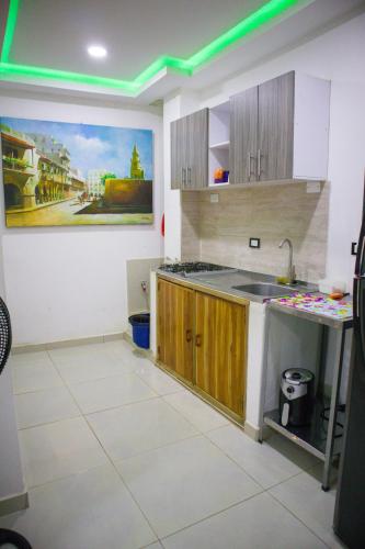 a kitchen with a sink and a counter top at Casa Playa Boquilla in Cartagena de Indias