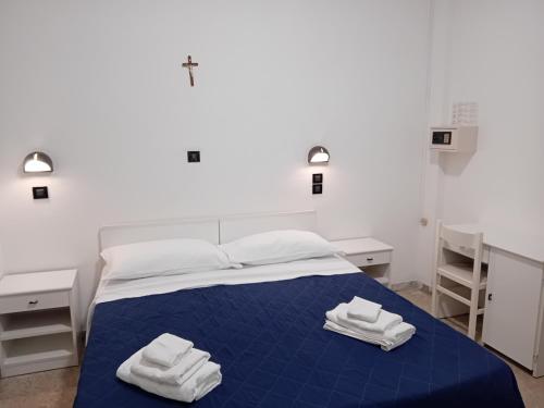 Postel nebo postele na pokoji v ubytování Hotel Mira