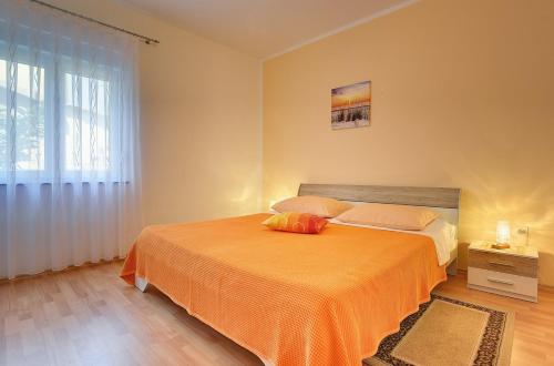 Postel nebo postele na pokoji v ubytování Apartments Danilo