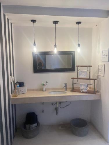 a bathroom with a sink and a mirror at Excepcional casa en barrio privado in Yerba Buena