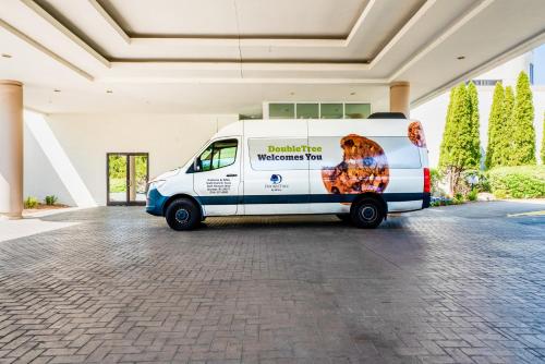 a white van parked inside of a building at DoubleTree by Hilton South Charlotte Tyvola in Charlotte