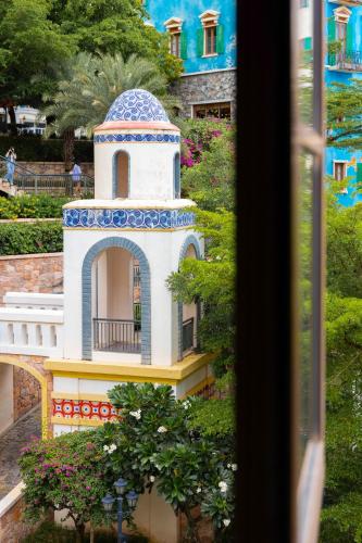 a model of a building in a garden at Lotus Home Corner & Rooftop in Phu Quoc
