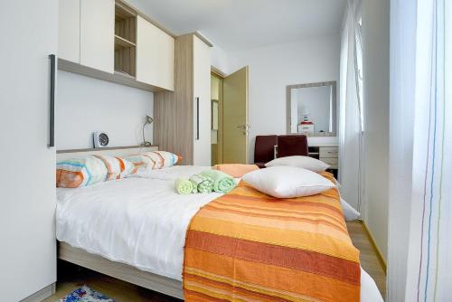 Postel nebo postele na pokoji v ubytování Apartments Elviana