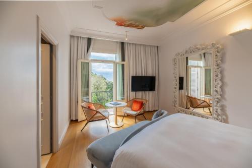 Una cama o camas en una habitación de Sofitel Roma Villa Borghese