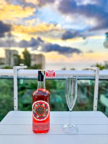 a bottle of wine and a glass on a table at Casa Playa Boquilla in Cartagena de Indias