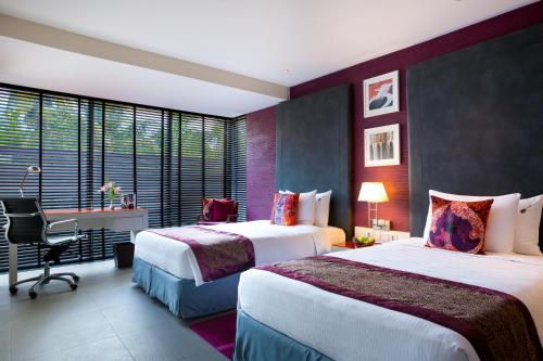 Ένα ή περισσότερα κρεβάτια σε δωμάτιο στο Hard Rock Hotel Goa Calangute