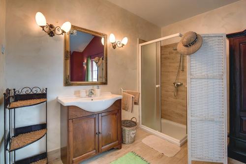 a bathroom with a sink and a shower at Villa Ari in Krnica