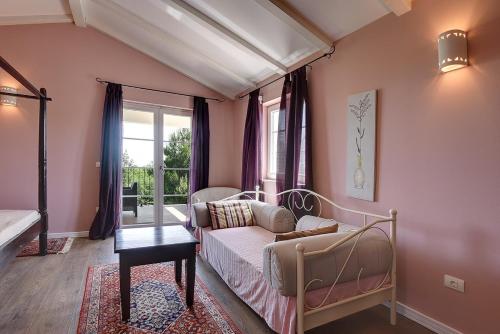 a living room with a couch and a window at Villa Oliva in Krnica