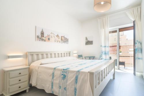 Postel nebo postele na pokoji v ubytování B&B S'Unda Jara