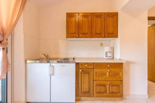 Kuchyň nebo kuchyňský kout v ubytování Apartments Vjera
