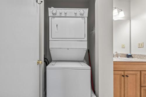 a white refrigerator in a kitchen with a sink at Brandywine Unit 203 in Myrtle Beach