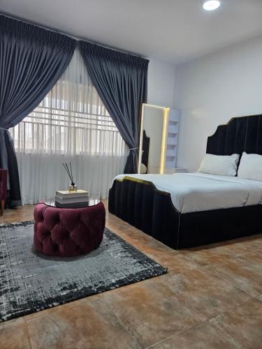 Postel nebo postele na pokoji v ubytování Pearl Homes