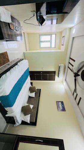 a small room with a bed and a sink at Hotel The Majestic Taj Near Tajmahal in Agra