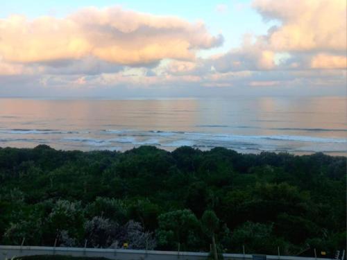 a view of the ocean under a cloudy sky at Waves of Mercy in Trafalgar