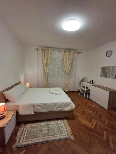 a bedroom with a large bed and a table at cà venice tour vaction in Mestre