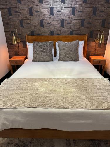 a bedroom with a bed with two night stands at The Block Basic - Queen in Bisbee