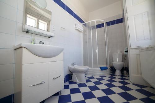 a bathroom with a sink and a toilet at Chateau Diva in Turčianske Teplice