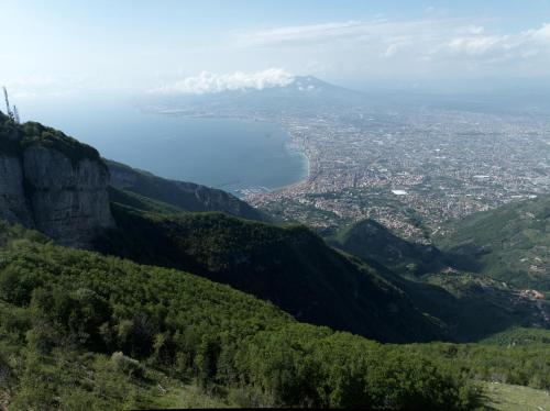 a view of a city from a mountain at Stabiae Suite Sorrento Coast Suites in Castellammare di Stabia
