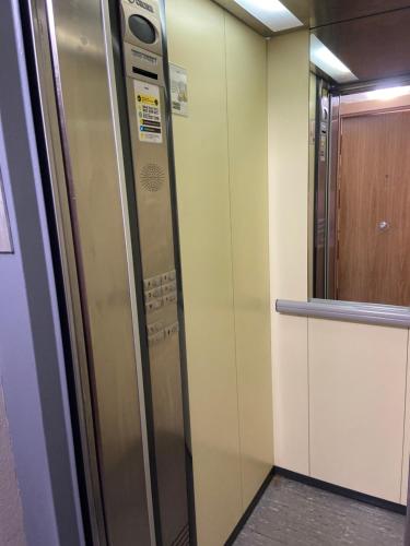 a elevator in a room with a door and a cabinet at KIKU Apartments II in Bermeo