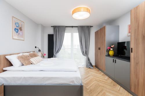 a bedroom with a bed and a window at Nowy Hotel Monika - by Upstairs in Kraków