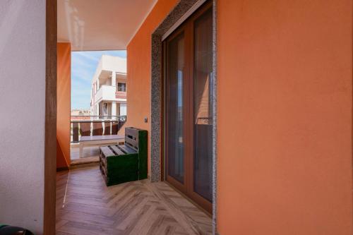 a view of a balcony from a room with a window at Paradise Home in Quartu SantʼElena