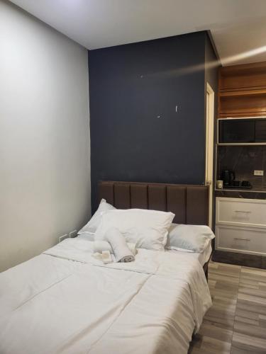 Postel nebo postele na pokoji v ubytování The Hive Staycation