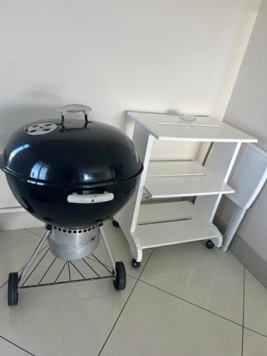 a kitchen with a black bowl and a table at Oceanway Self-catering Accommodation in Gonubie