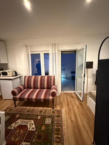 a living room with a couch and a rug at Apartment Bad Nauheim central in Bad Nauheim