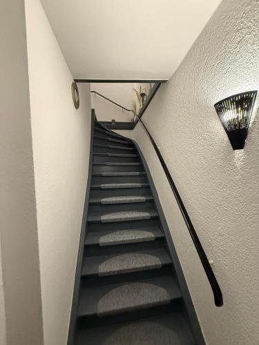 a staircase with a cat sitting on top of it at Apartment Bad Nauheim central in Bad Nauheim