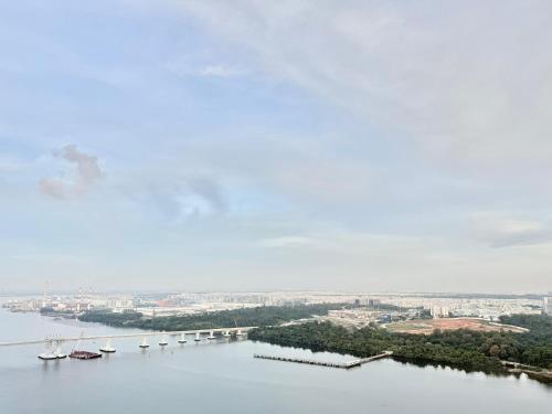 a view of a river with a bridge and boats at R&F Seine Region in Johor Bahru