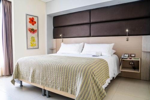 Postel nebo postele na pokoji v ubytování Wyndham Garden Barranquilla