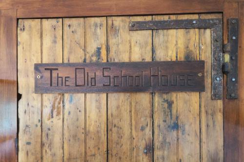 a wooden door with a sign that reads the old school house at The Classroom, Patricks Square, Wexford Town in Wexford