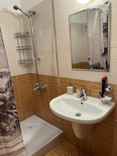 a bathroom with a sink and a shower at Apartment for rest in Borovets in Borovets