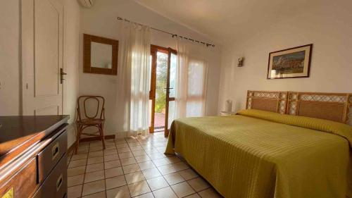 Una cama o camas en una habitación de Le tre Palme