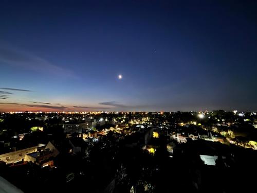 a view of a city at night at MINISUITE GAONA - Studio - Estacion de Ramos Mejia in Ramos Mejía