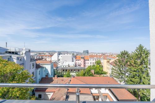 a view of a city from a balcony at Vienna Stay Apartments Schönbrunn in Vienna