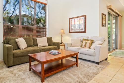 a living room with two couches and a coffee table at Big Island Fairways at Mauna Lani 1701 by Coldwell Banker Island Vacations in Waikoloa