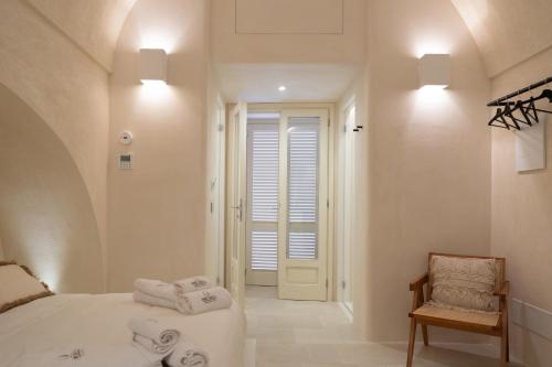 Postel nebo postele na pokoji v ubytování Dimore Pignatelli Apulian Suite