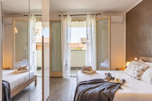 a bedroom with a large bed and a mirror at Spacious Apartment in Lissone in Desio
