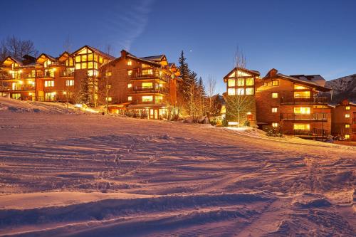 a large house in the snow at night at Crestwood 2309 Deluxe 1 Bedroom plus Loft in Snowmass Village