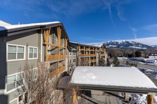 a balcony with snow on the roof of a building at Silver Rock Condominiums by Fernie Central Reservations in Fernie