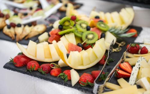 a tray of fruits and vegetables on a table at Casa del Monte - Dorna Arini in Dorna Arini