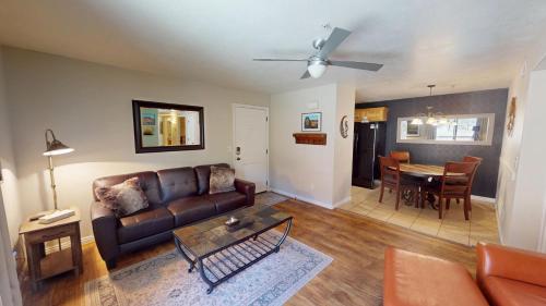 a living room with a couch and a table at Red Cliff Condos #3E in Moab