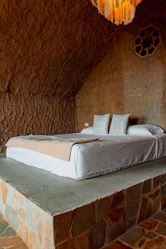 Hotel Pachamama Campestreにあるベッド