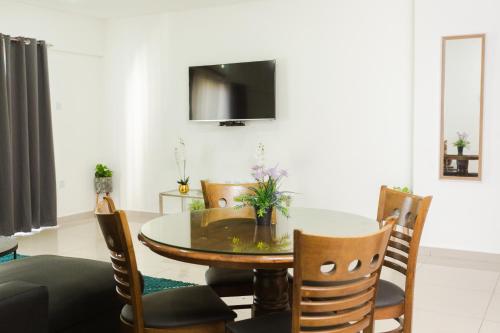 a dining room with a table and chairs at Accra Luxury Apartments at The Gallery in Accra