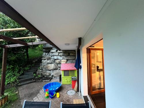 a view of a house with a play area at Alpine feeling & lakeside in Kienholz