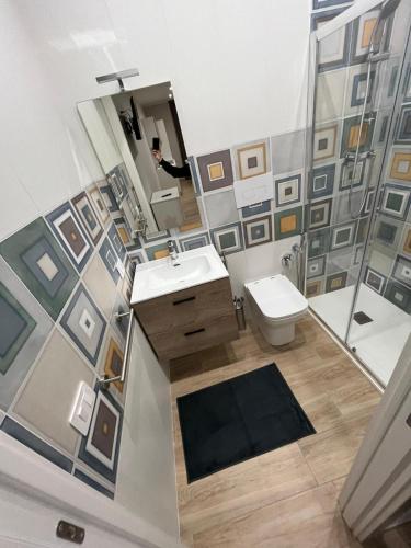 a bathroom with a sink and a toilet and a shower at A due passi dal mare in Barletta
