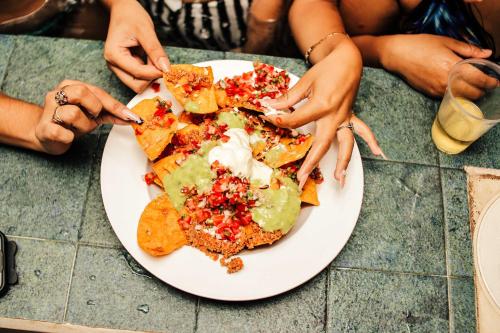 a plate of food on top of a table at Hotel Petén Express in Flores