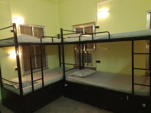 a group of bunk beds in a room at Bubble Beds in Kolkata